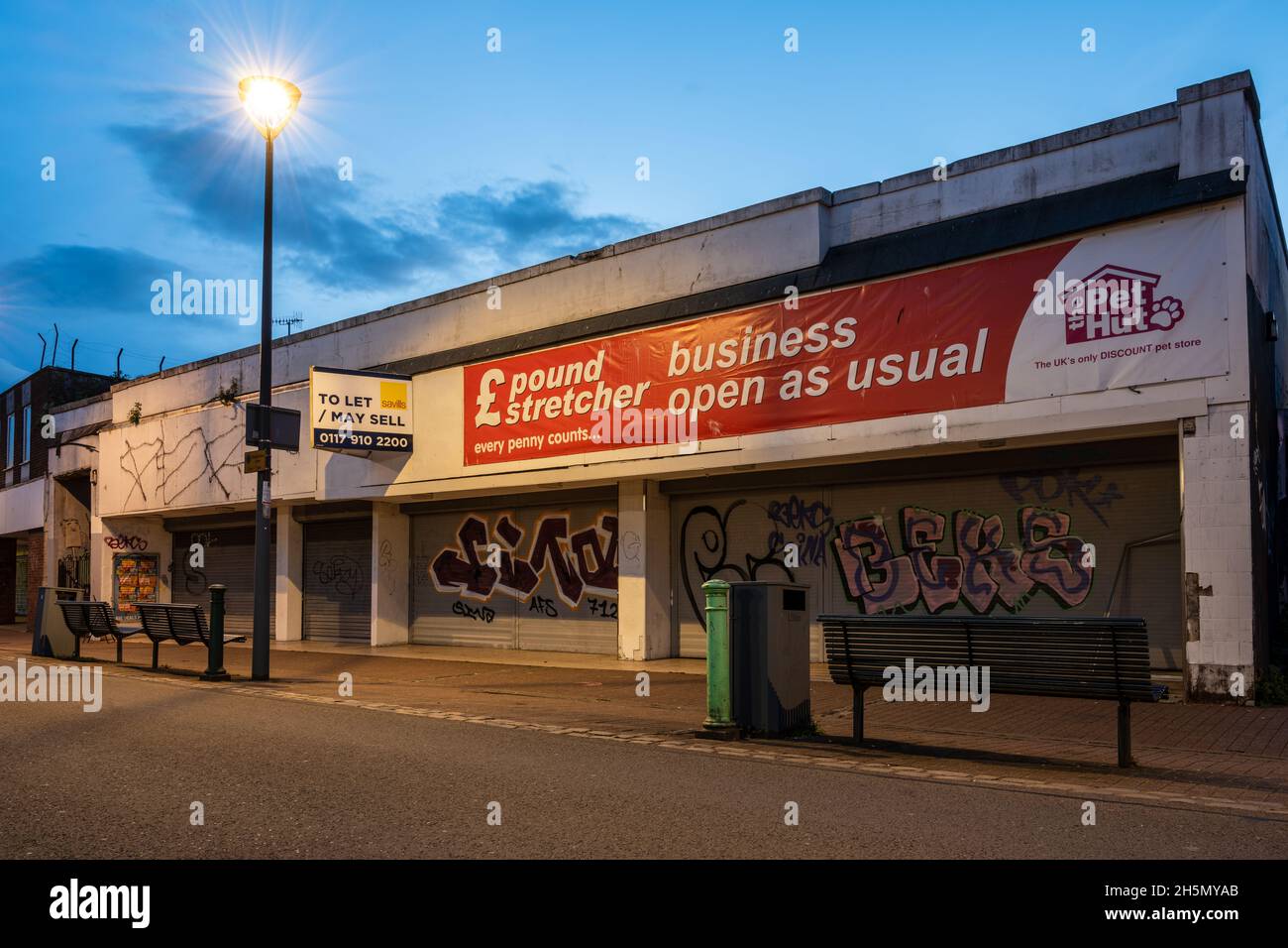 Run-down shopping units are advertised to let during regeneration of Bedminster's East Street in Bristol. Stock Photo