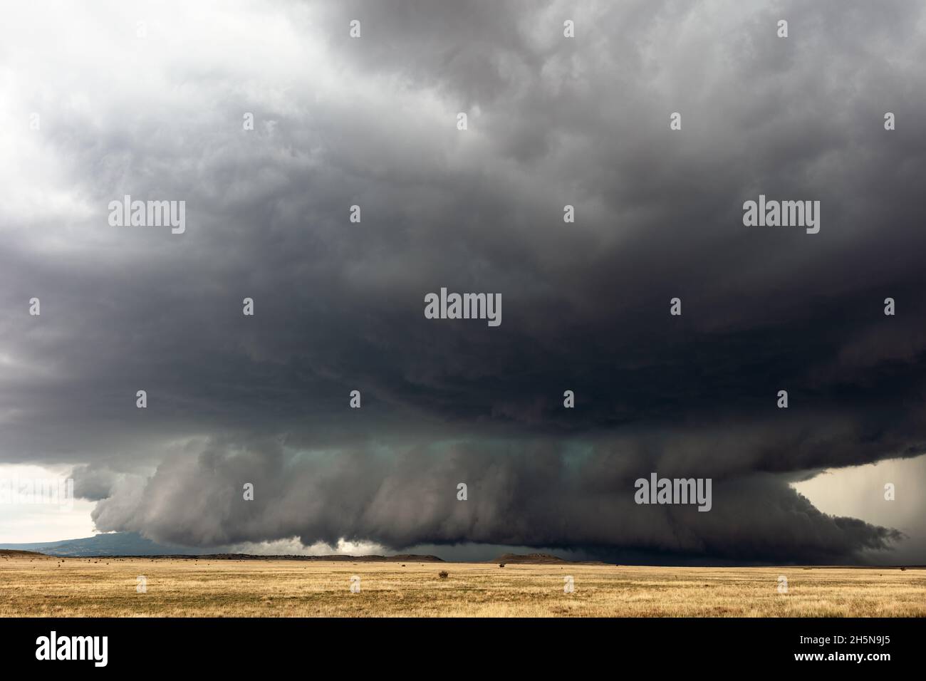 Stormy sky and ominous wall cloud beneath a supercell thunderstorm near Kim, Colorado Stock Photo