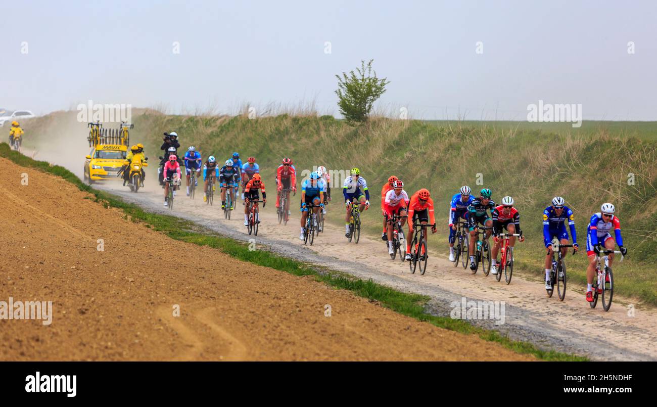 Viesly France April 14 2019 The peloton riding on the dusty cobblestone road from Briastre to Viesly during Paris Roubaix 2019 Stock Photo Alamy