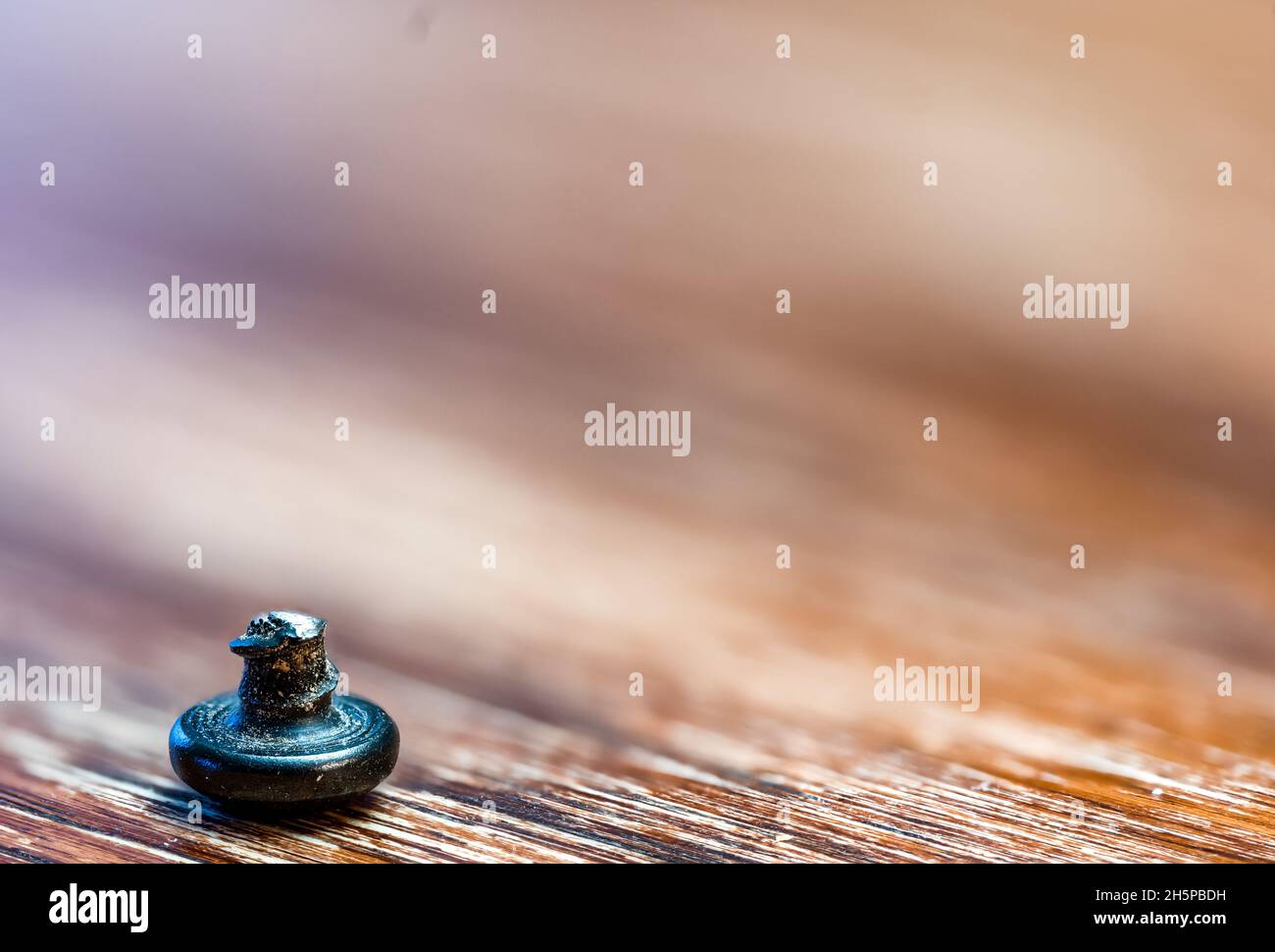 bolt head turned over to show sheared threading after stress failure