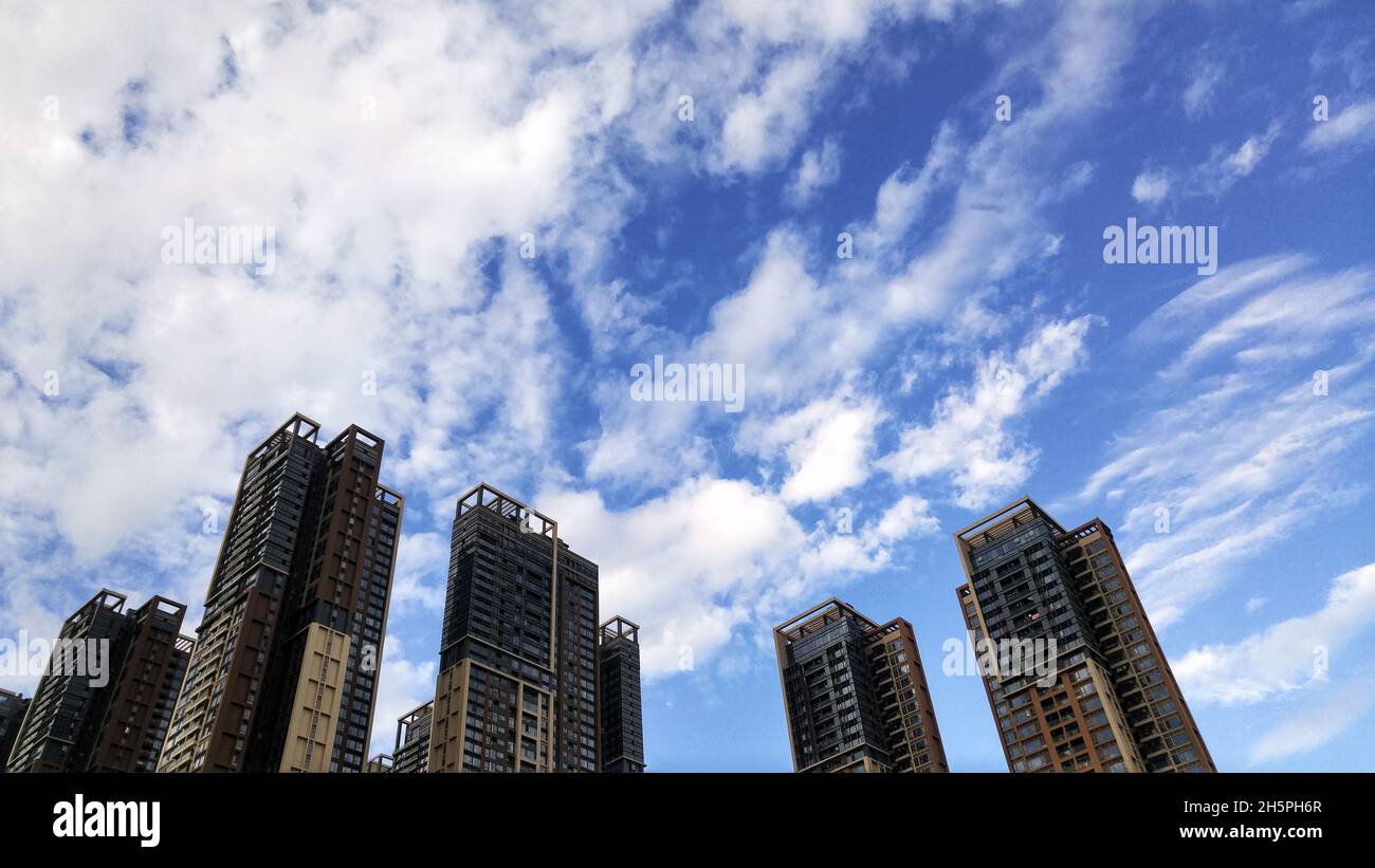 Blue sky and white clouds buildings hi-res stock photography and images ...