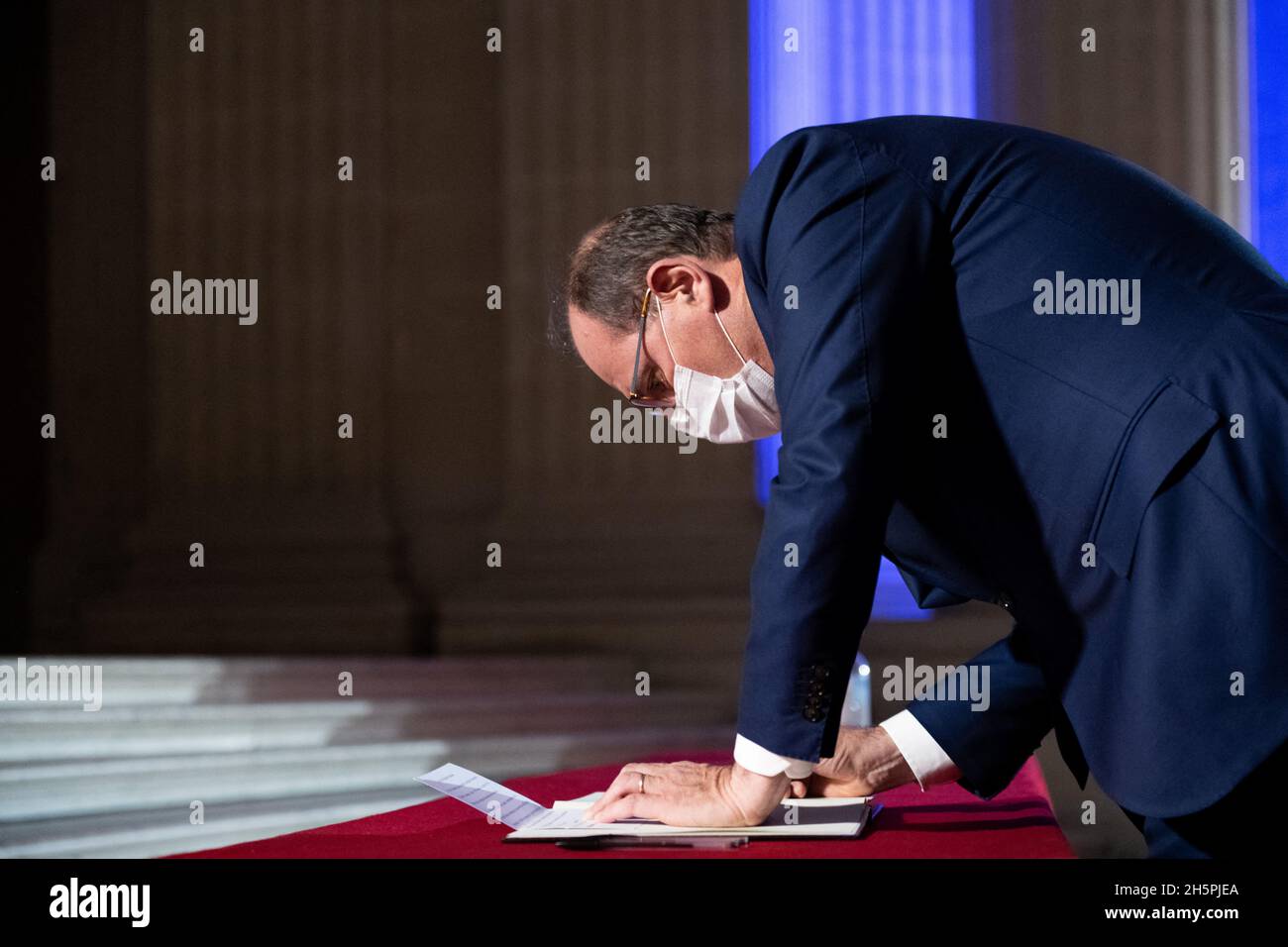 Prime Minister Jean Castex writes a note in the book honouring the last ...
