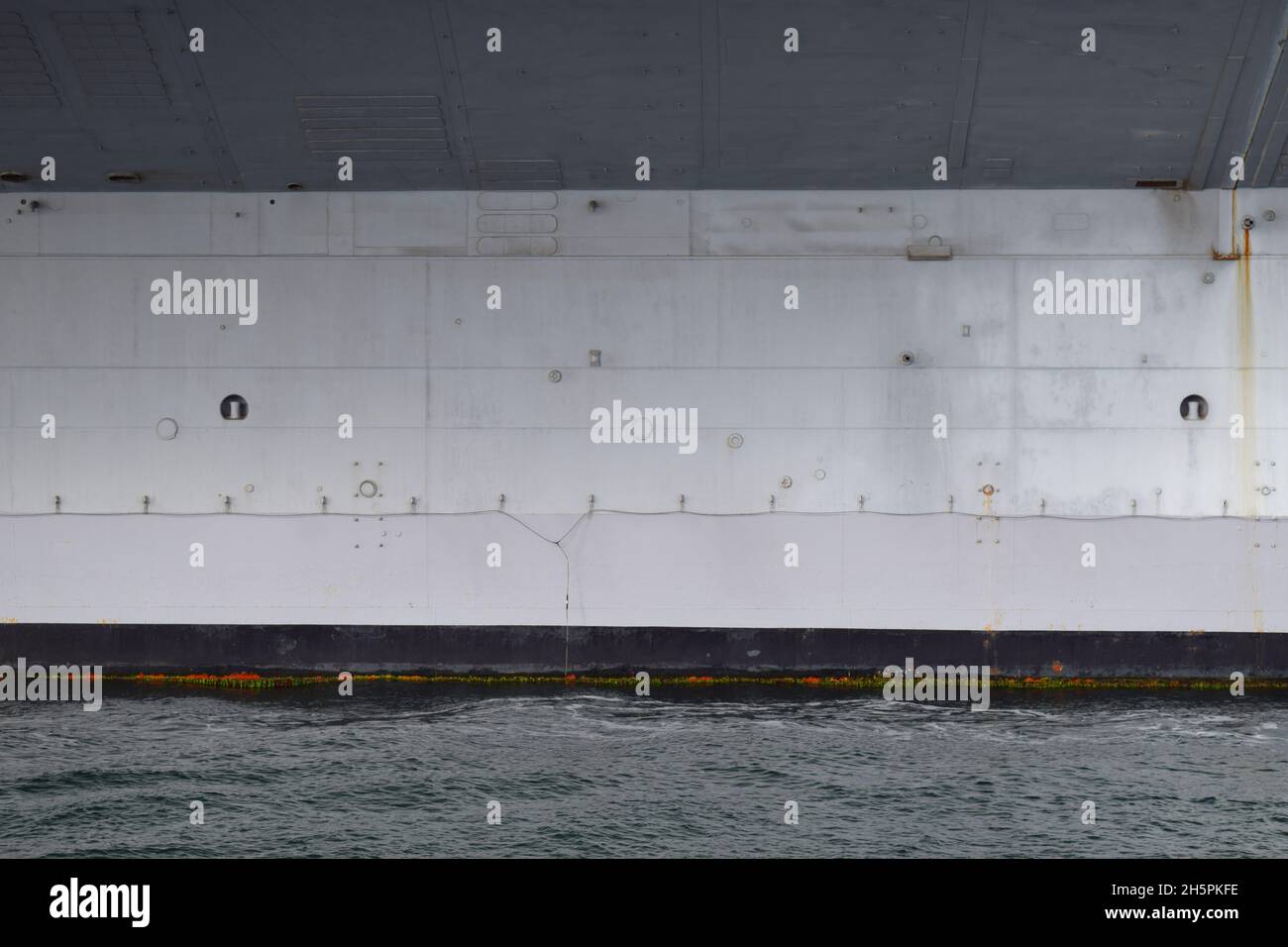 Closeup view of the hull of aircraft carrier USS Midway, moored in San Diego Stock Photo