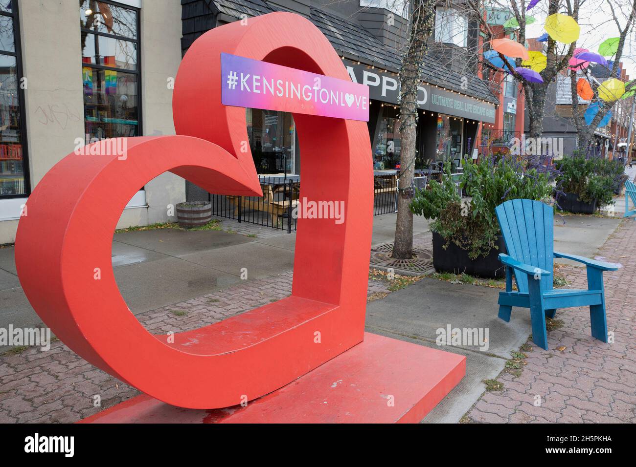 Red heart with #kensingtonlove, an art installation for a celebration of love, inclusivity and community in Kensington Village, Calgary, Alberta Stock Photo