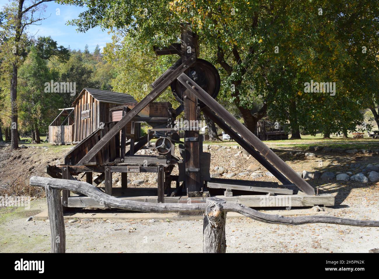 View of a California stamp mill used during the gold rush, a device used to crush ore or stone to reveal deposits of gold. Stock Photo