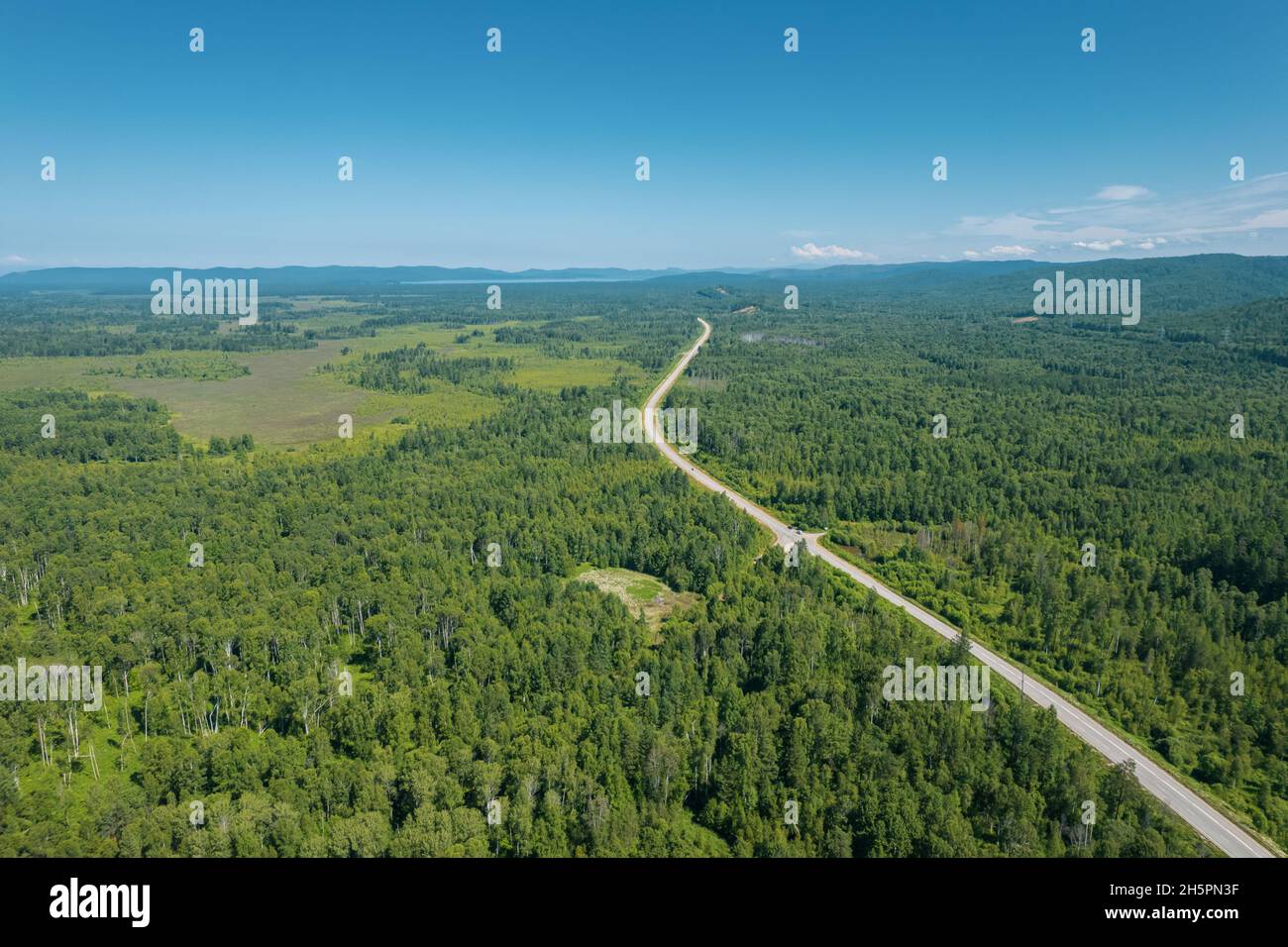 Zigzag road in the West Siberian taiga ecoregion. Baikal, Russia. Stock Photo