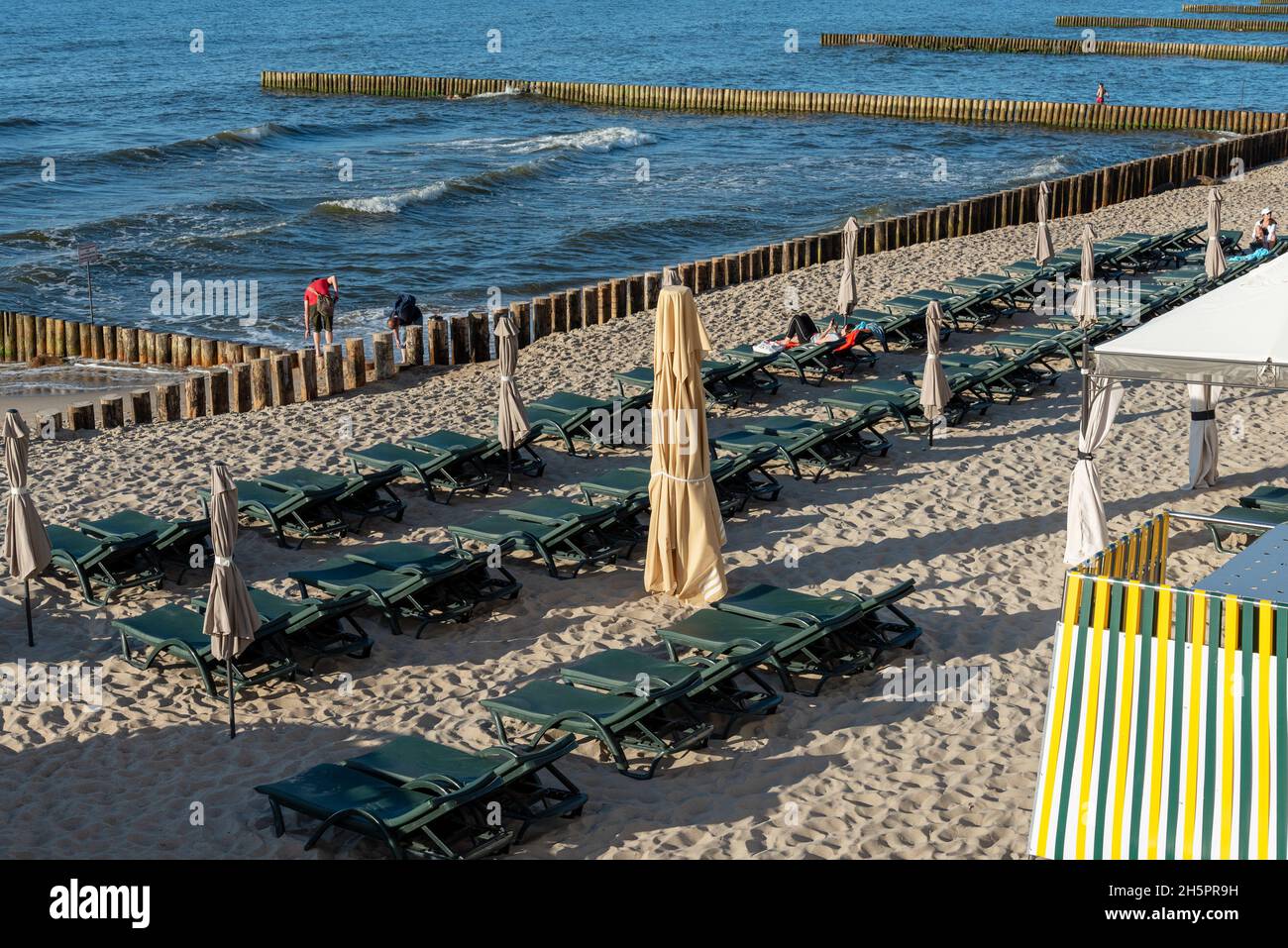 Sun beds on the shore of the Baltic Sea in the city of Zelenogorsk. The concept of recreation and entertainment. Stock Photo