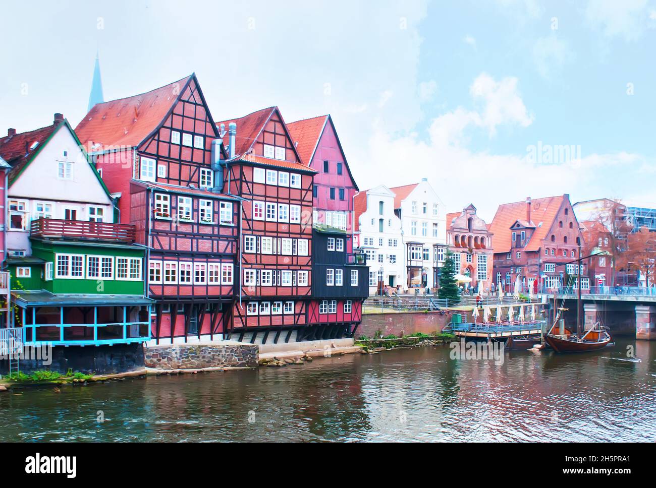 The old harbour on Ilmenau river in surrounding of half-timbered houses, Luneburg, Germany Stock Photo