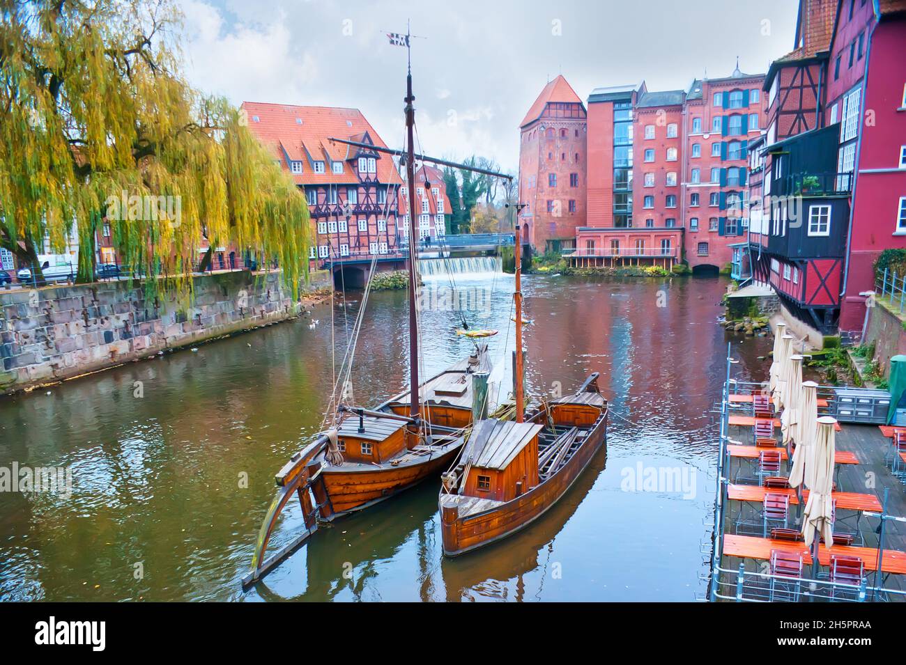 Stintmarkt (smelt market) of Hanseatic town Lüneburg, with Salz-Prahm and Salz-Ewer boats, Lower Saxony, Germany Stock Photo