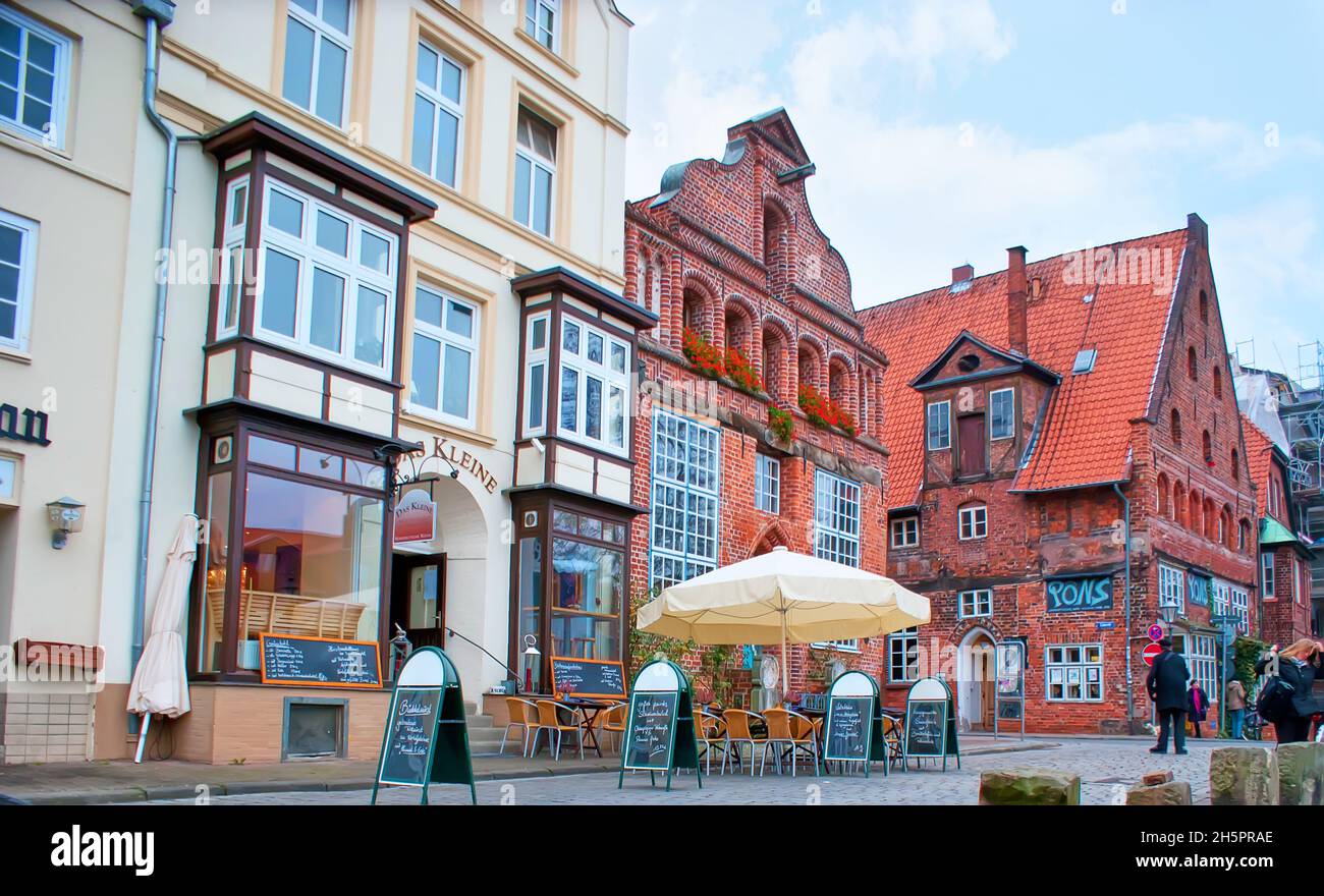LUNEBURG, GERMANY - NOVEMBER 20, 2019: The scenic medieval houses of Altstadt with cozy cafesa and shops, on Nov 20 in Luneburg, Germany Stock Photo
