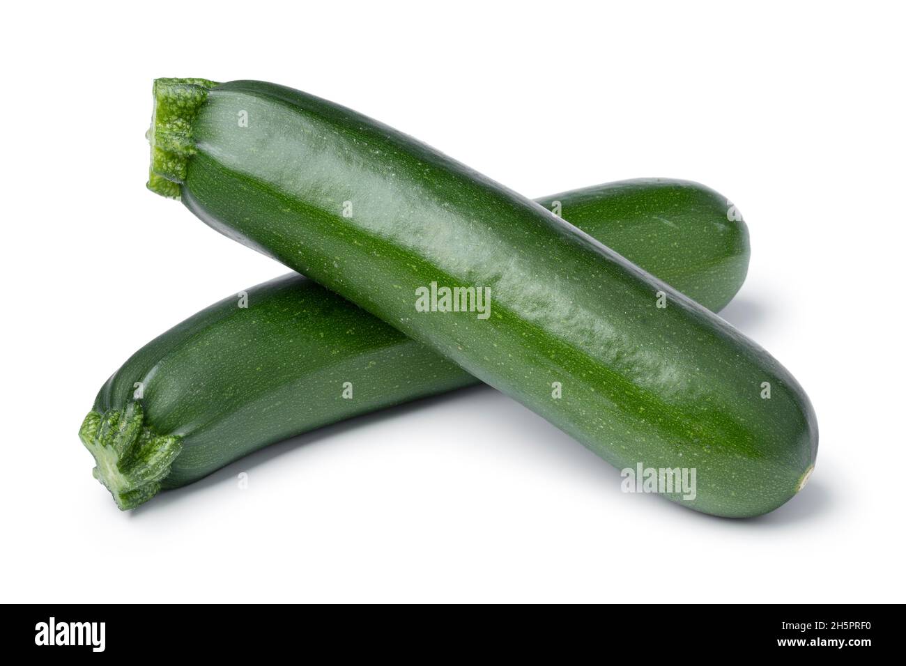 Pair of fresh green whole zucchini isolated on white background Stock