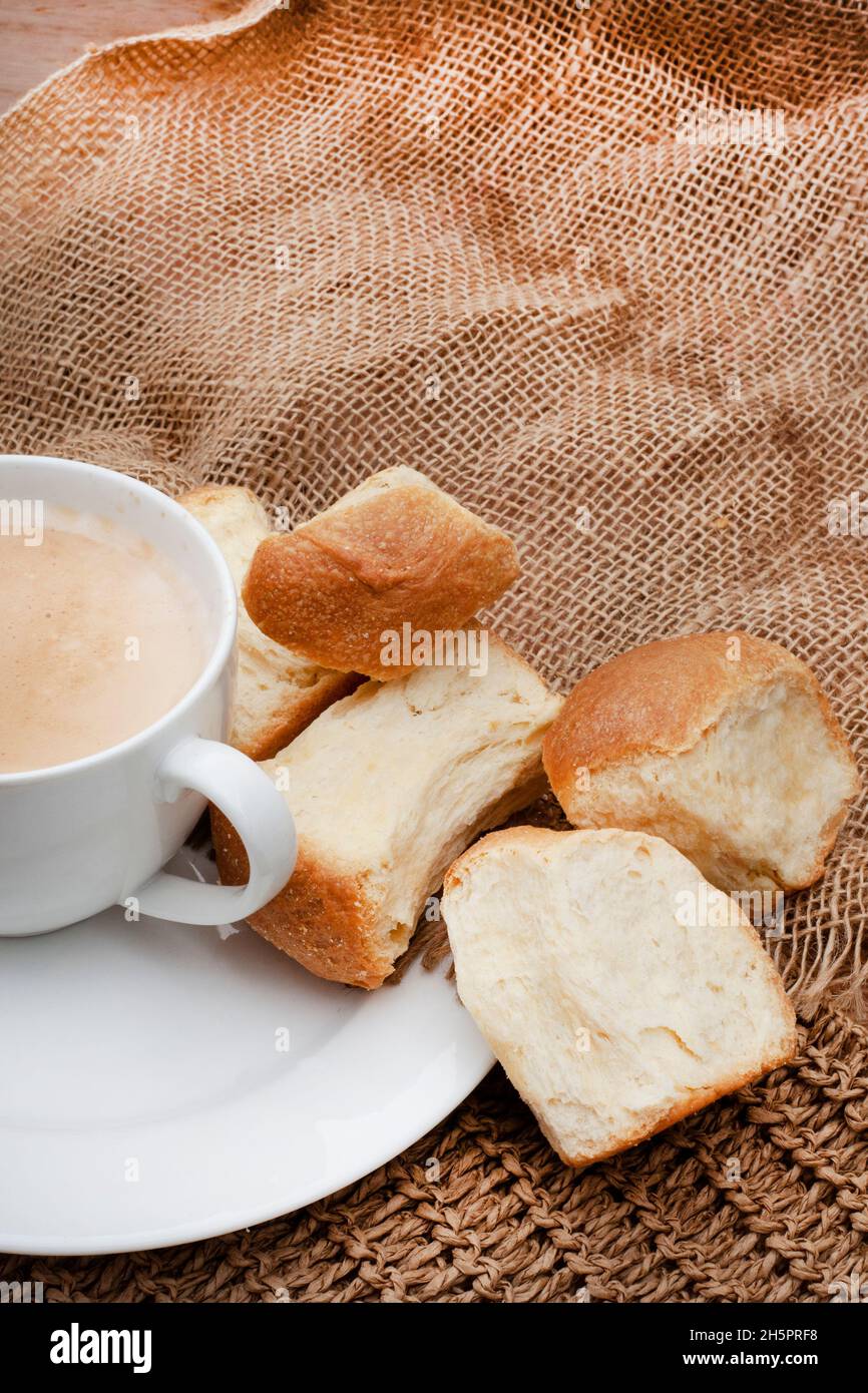 coffee and fresh traditional South African Rusks on rustic table Stock