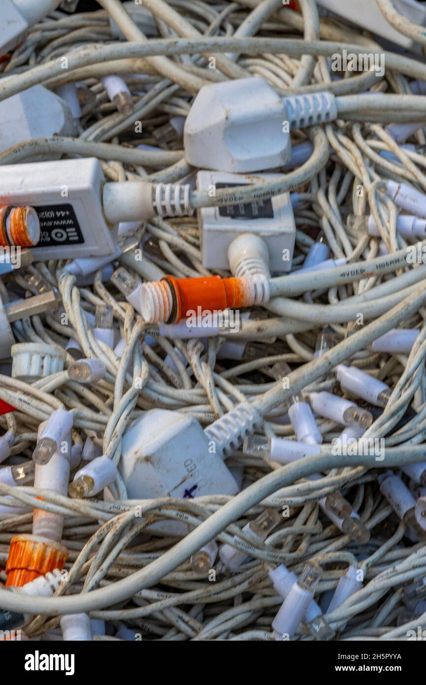 large amount of tangled and knotted electrical cables and wires in a