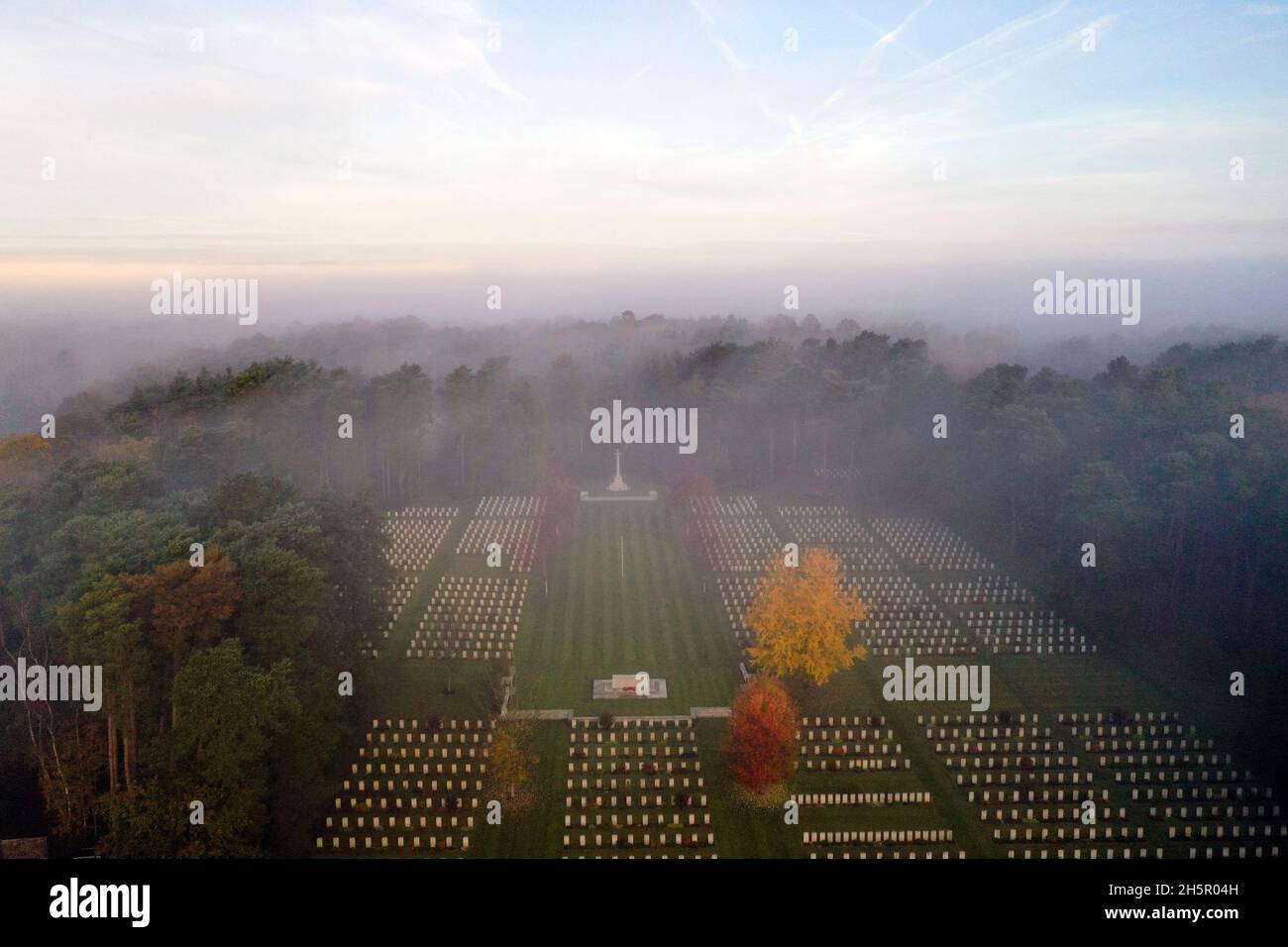 The early morning mist on Armistice Day over First and Second World War graves at the Commonwealth War Graves Commission's Brookwood Military Cemetery in Woking Surrey. People across the UK will observe a two minute silence at 11 o'clock to remember the war dead. Picture date: Thursday November 11, 2021. Stock Photo