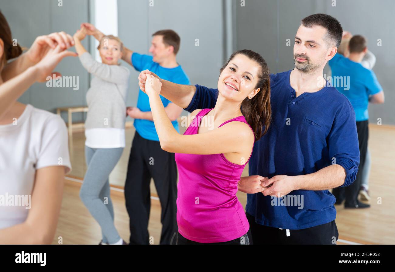 Young couple practicing active dance in pair Stock Photo