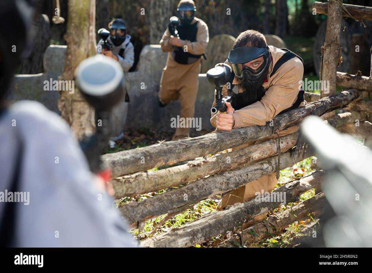 Paintball players aiming outdoors Stock Photo Alamy