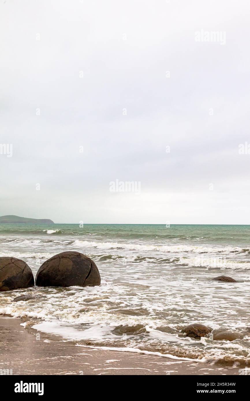 The huge round boulders of Moeraki. The Pacific coast. South Island, New Zealand Stock Photo