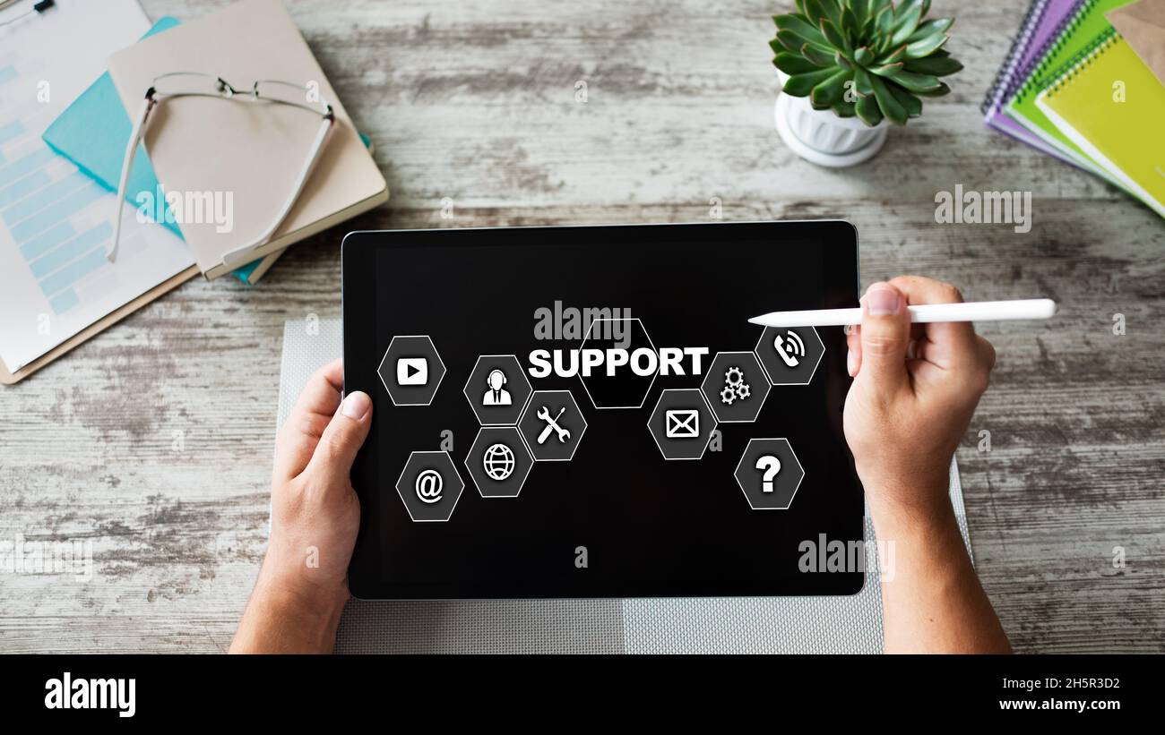 Technical support icons on screen. Call to help center. Internet and technology concept. Stock Photo