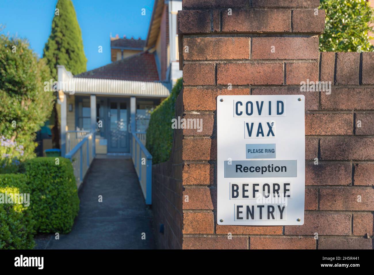 Sydney, Australia Sept 2021: A sign outside a doctor's surgery asking patients wanting a covid-19 vaccination to call before entry Stock Photo