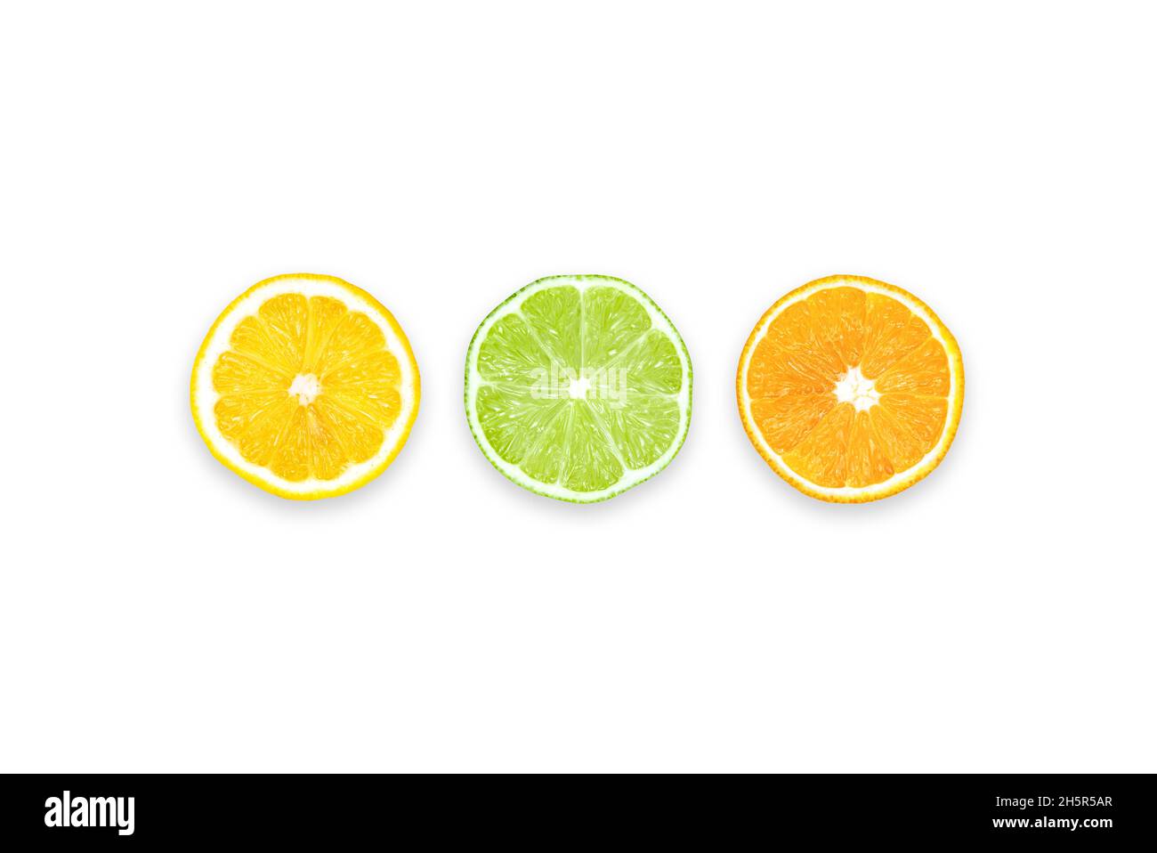 Lemon, Lime and Orange: Three slices of different citrus fruits. Table top view, flat lay, copy space. Stock Photo