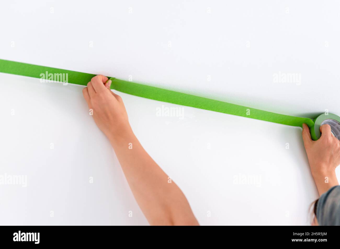 Application of multi surface painters masking tape before painting the walls, Process of