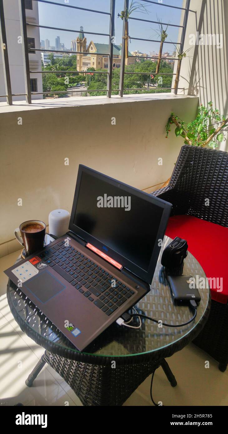KARACHI, PAKISTAN Oct 14, 2021 A coffee mug, Cuban cigar, laptop on