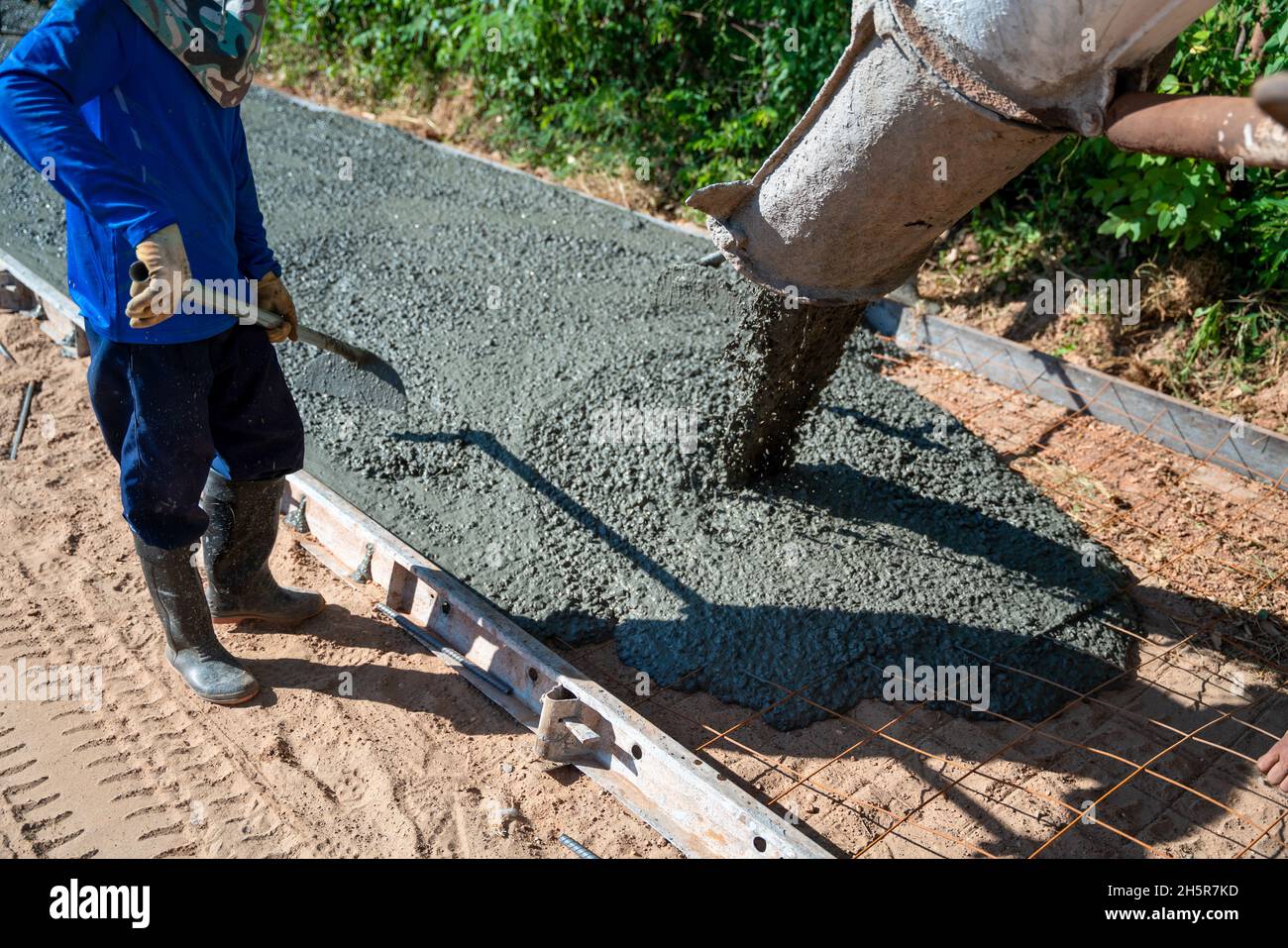 Pouring readymixed concrete after placing steel reinforcement