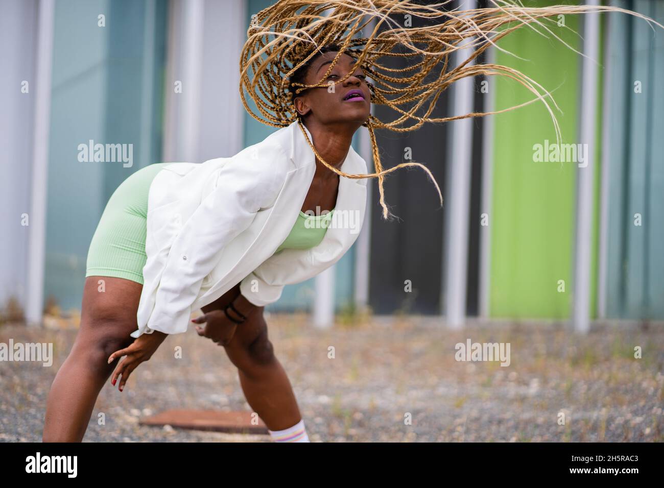 Photo with copy space of a black woman with braids dancing freestyle in ...