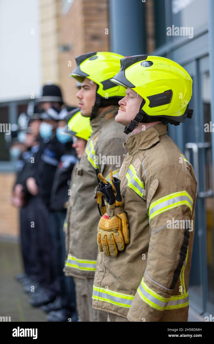 Cradley Heath, West Midlands, UK. 11th Nov, 2021. Fire and rescue service Blue Watch of Haden Cross fire station, West Midlands Fire Service in Cradley Heath, West Midlands, stand to attention with police colleagues on Remembrance Day at 11am for a two minute silence. Credit: Peter Lopeman/Alamy Live News Stock Photo