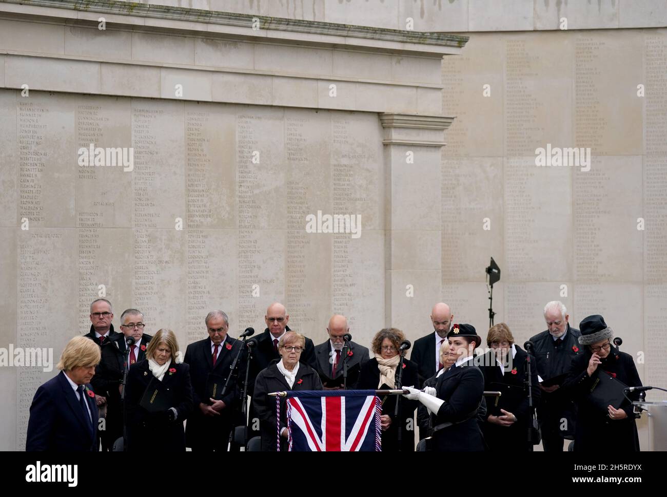 Conservative MP Michael Fabricant (left) observes a two minute silence to remember the war dead on Armistice Day at the Armed Forces Memorial, at the National Memorial Arboretum, in Alrewas, Staffordshire. Picture date: Thursday November 11, 2021. Stock Photo