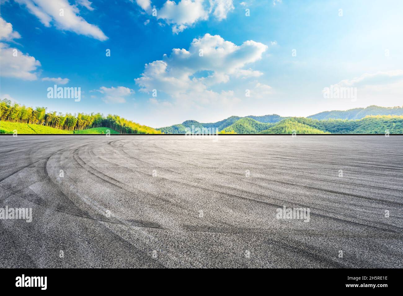 Asphalt Road And Green Mountain With Bamboo Forest Natural Landscape asphalt-road-and-green-mountain-with-bamboo-forest-natural-landscape