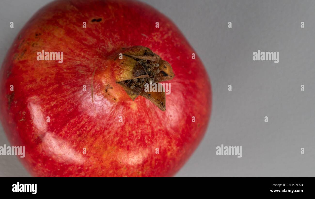 Healthy fresh pomegranate fruit open pomegranate isolated on light grey background. Stock Photo