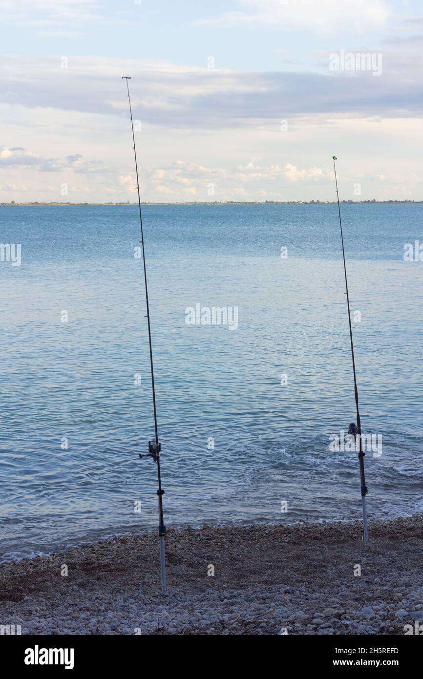 Fishing with fishing rods at the seashore Stock Photo
