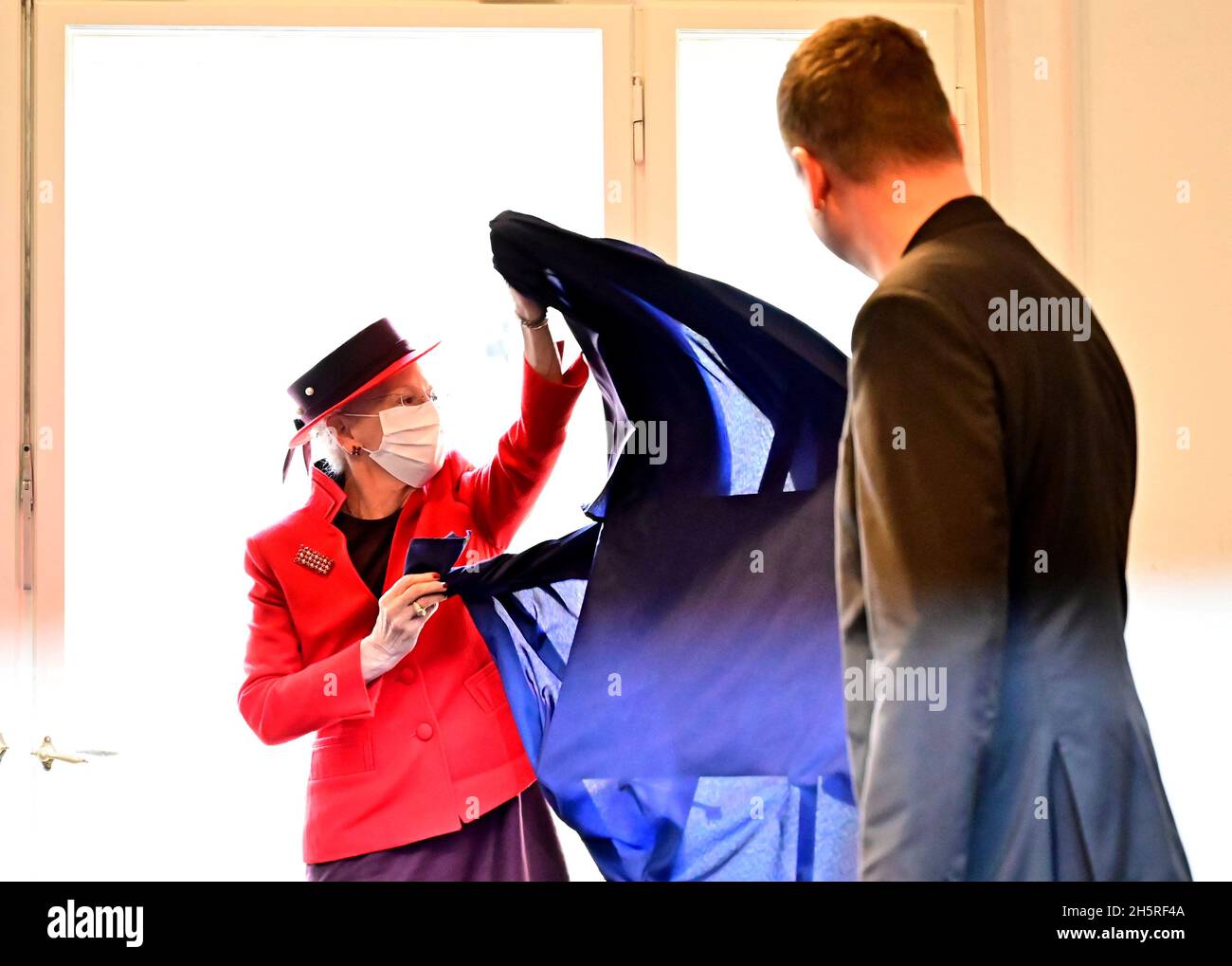Denmark's Queen Margrethe and Berlin's Senator for Culture Klaus Lederer  unveil a memorial plate for Danish author Herman Bang durig her visit to  the Literaturhaus (Literature house) in Berlin, Germany November 11,