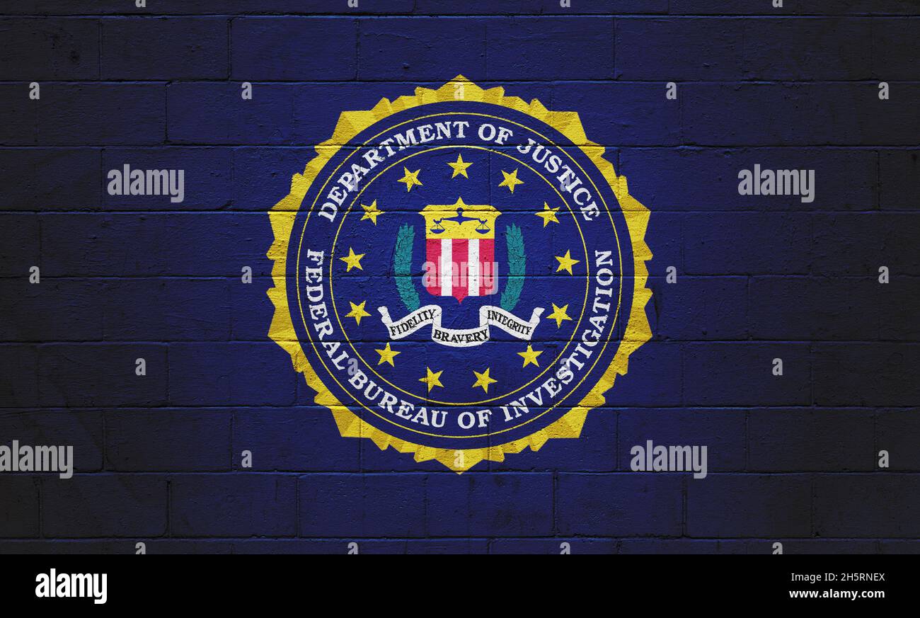 The FBI flag (Federal Bureau of Investigation) painted on a brick wall. Stock Photo