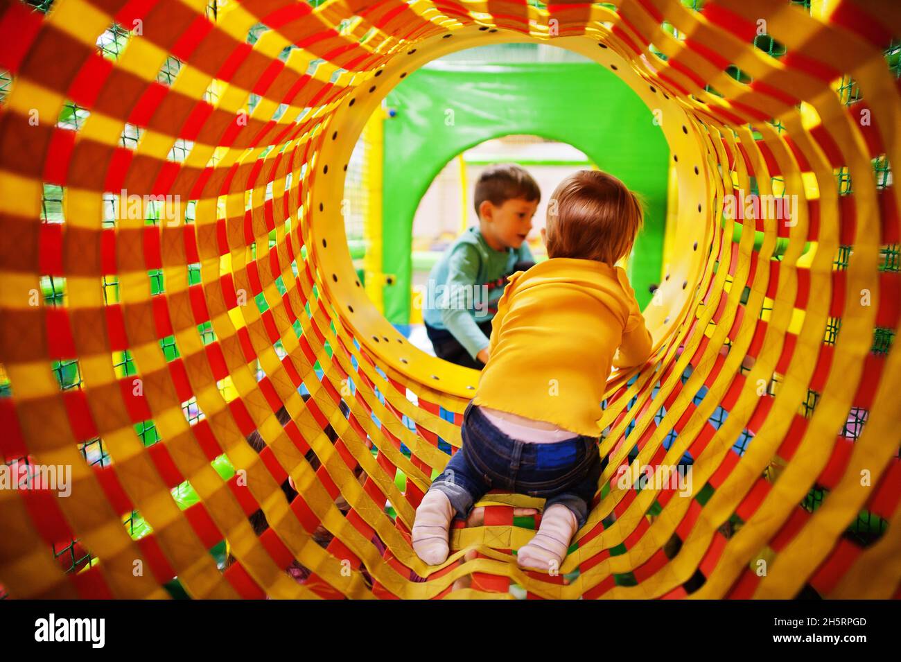 Kids playing in indoor play center. Kindergarten or preschool play room