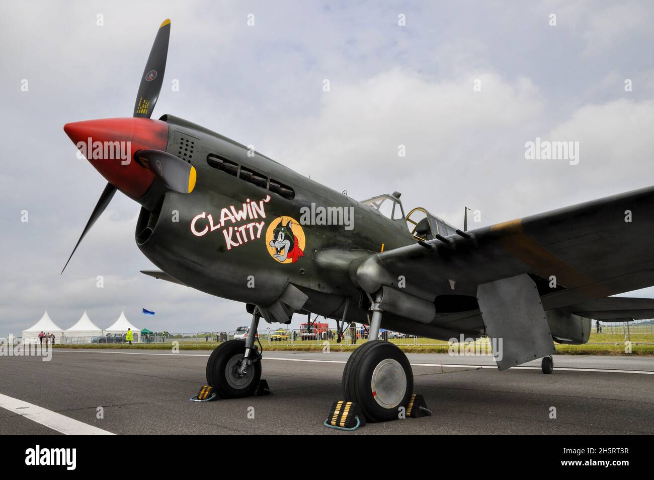 Curtiss P-40 Kittyhawk G-KITT of Hangar 11 at Biggin Hill airshow. Wearing a temporary water washable scheme, after filming Red Tails film. Nose art Stock Photo