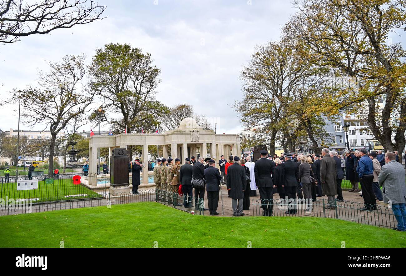 Brighton UK 11th November 2021 - The last post is played as members of the public and local dignitaries gather at Brighton War Memorial for a Remembrance service on Armistice Day in the UK : Credit Simon Dack / Alamy Live News Stock Photo
