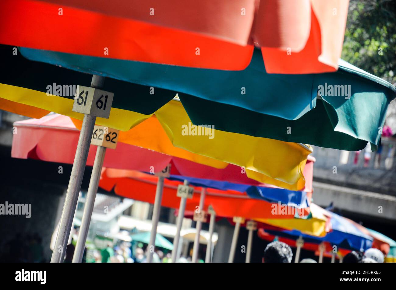 Set of multi-colored umbrellas with table numbers at a restaurant in the Riverwalk area in San Antonio, Texas Stock Photo
