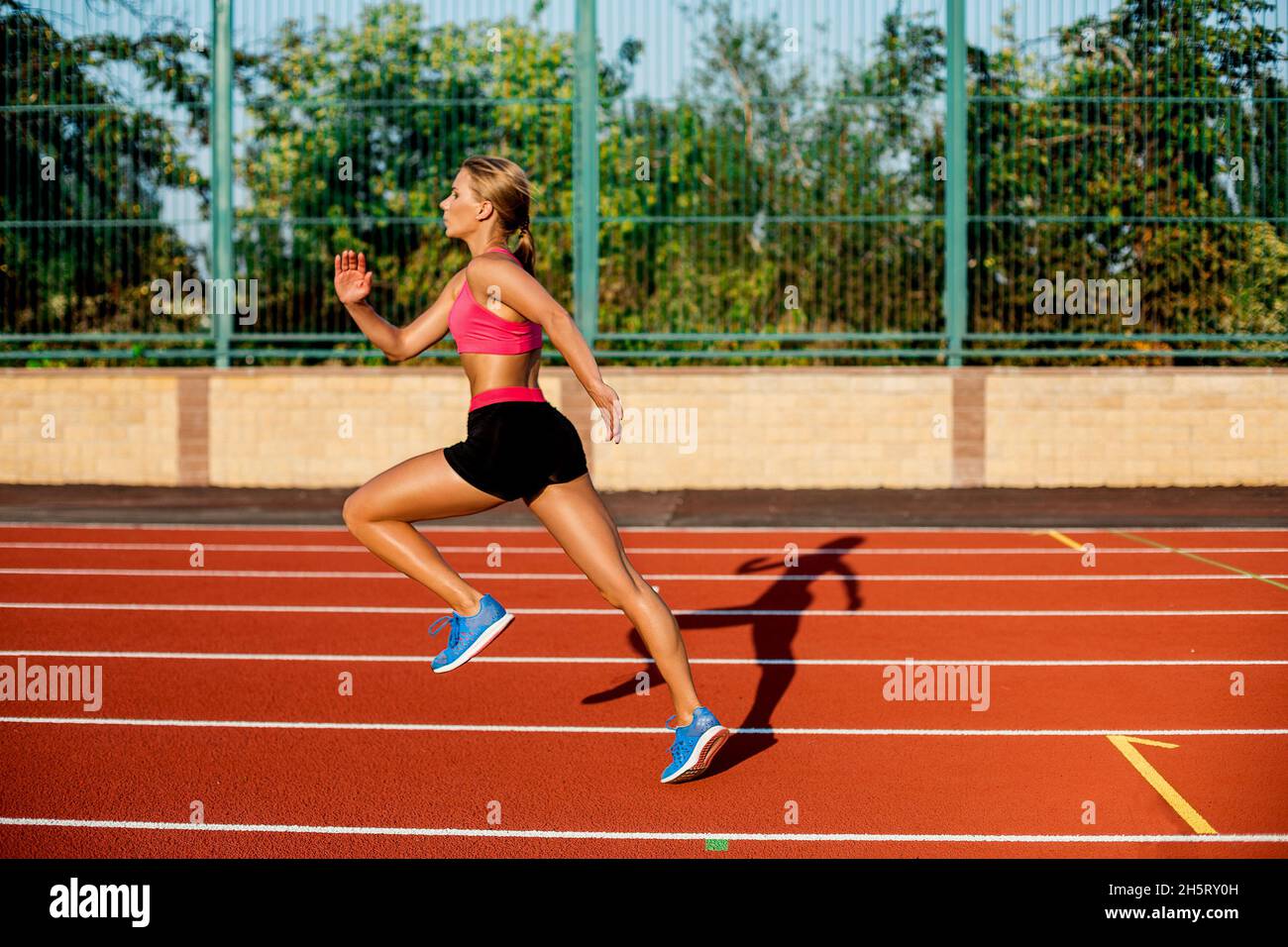 Side view beautiful young woman exercise jogging and running on