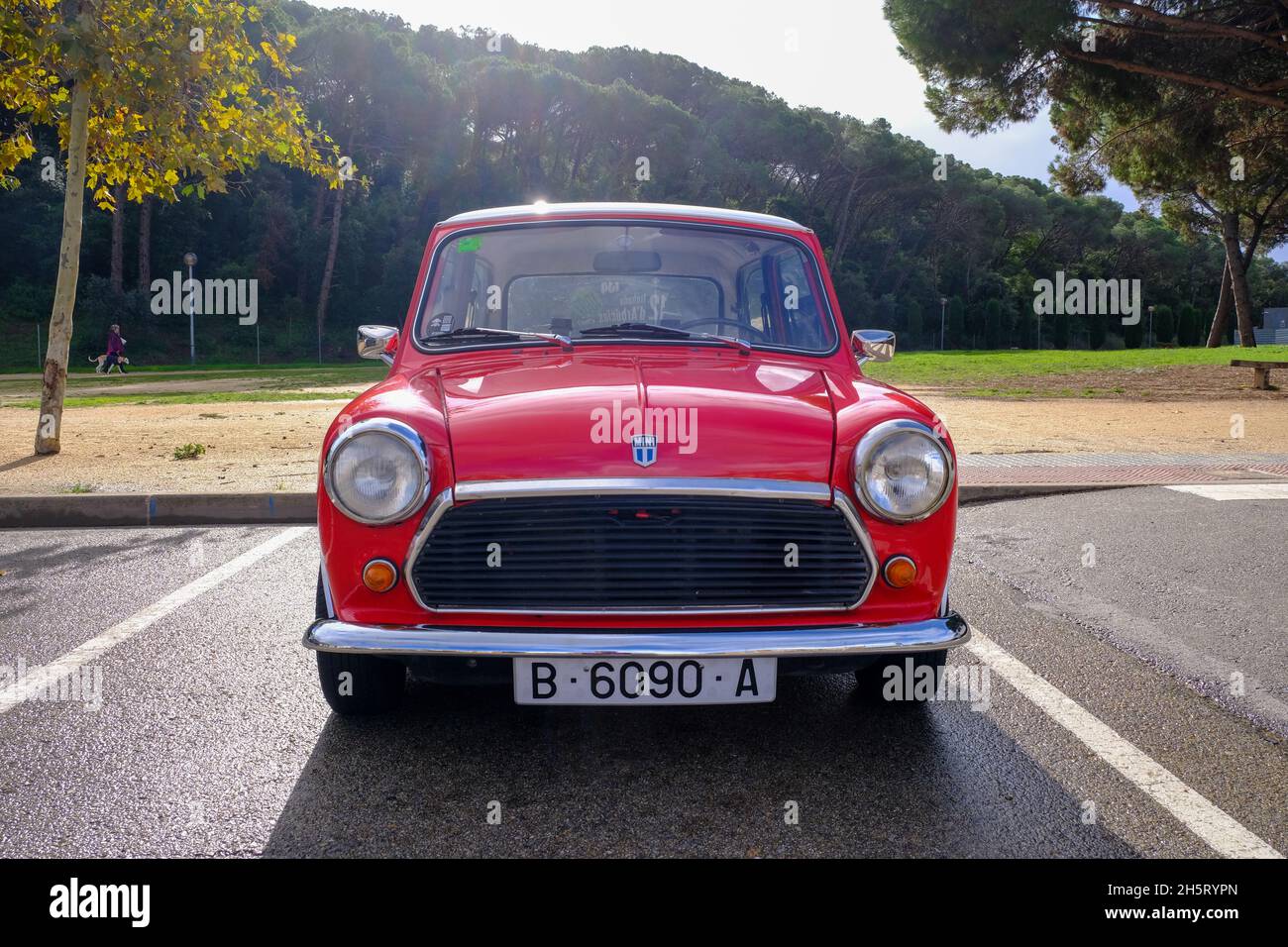 Lloret de Mar, Catalonia, Spain - 11.11.2021: bright red Mini 850 model old retro car in perfect condition parked on the city street Stock Photo
