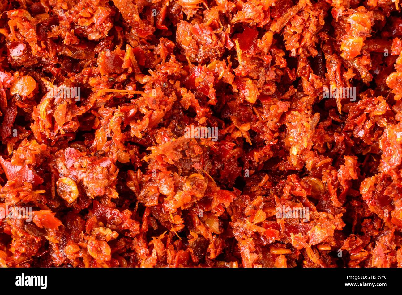 spicy maldives fish chips or flakes condiment, made with chili peppers, tomato, ginger, garlic and salt, fresh food background texture, closeup Stock Photo
