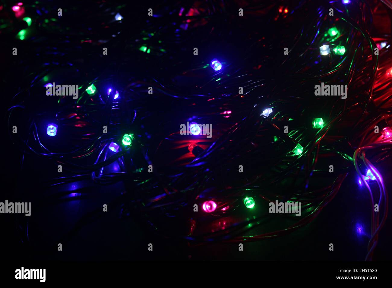 Abstract background with colorful LED lights glowing in the dark Stock
