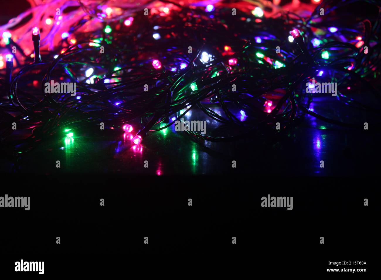 Abstract background with colorful LED lights glowing in the dark Stock