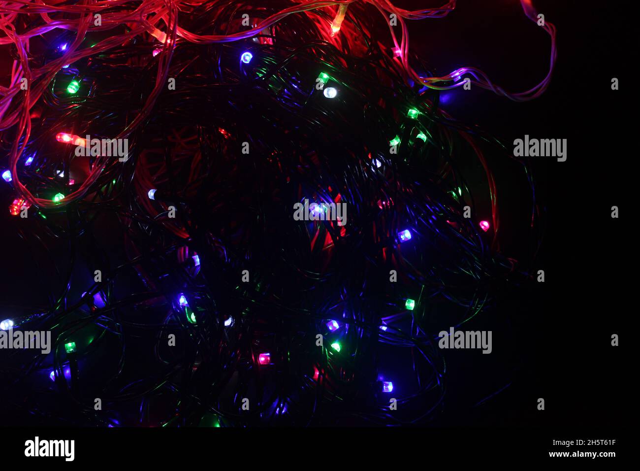 Abstract background with colorful LED lights glowing in the dark Stock