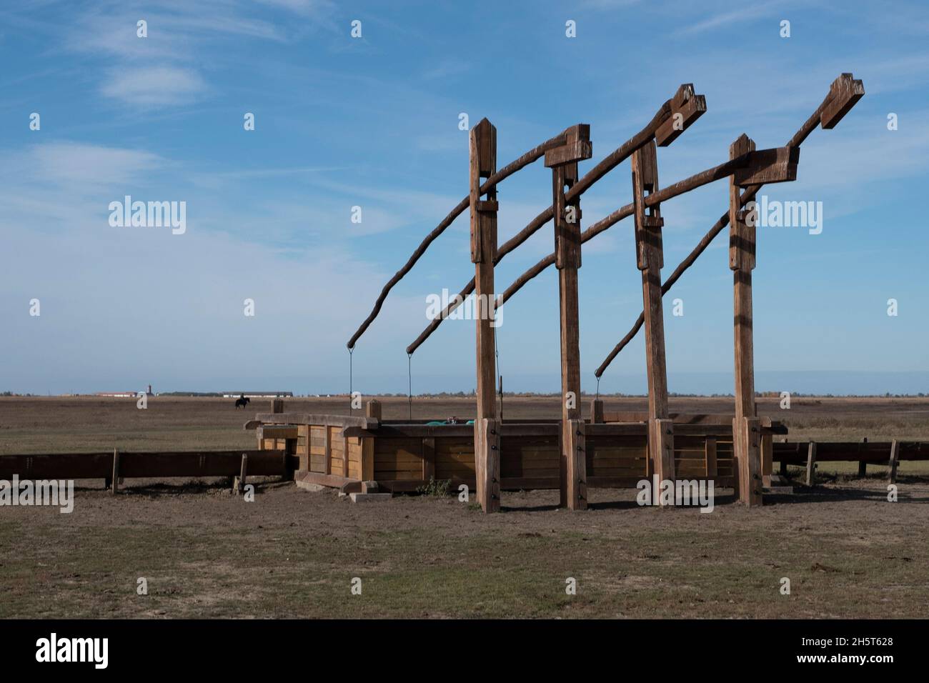 Wooden T-shaped sweep wells, Hortobagy National Park, Hungary Stock Photo
