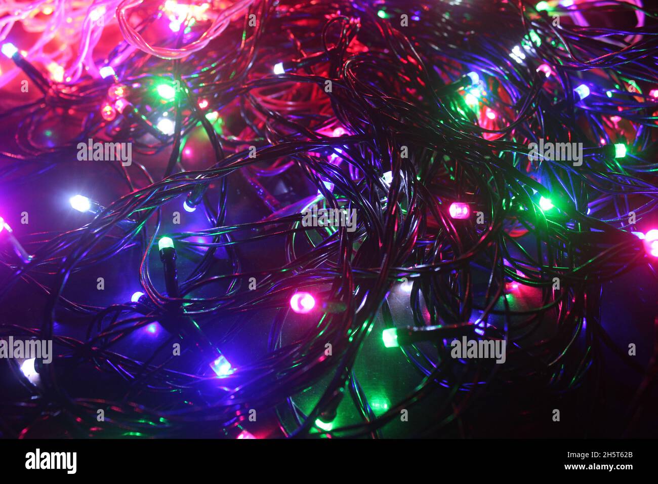 Abstract background with colorful LED lights glowing in the dark Stock