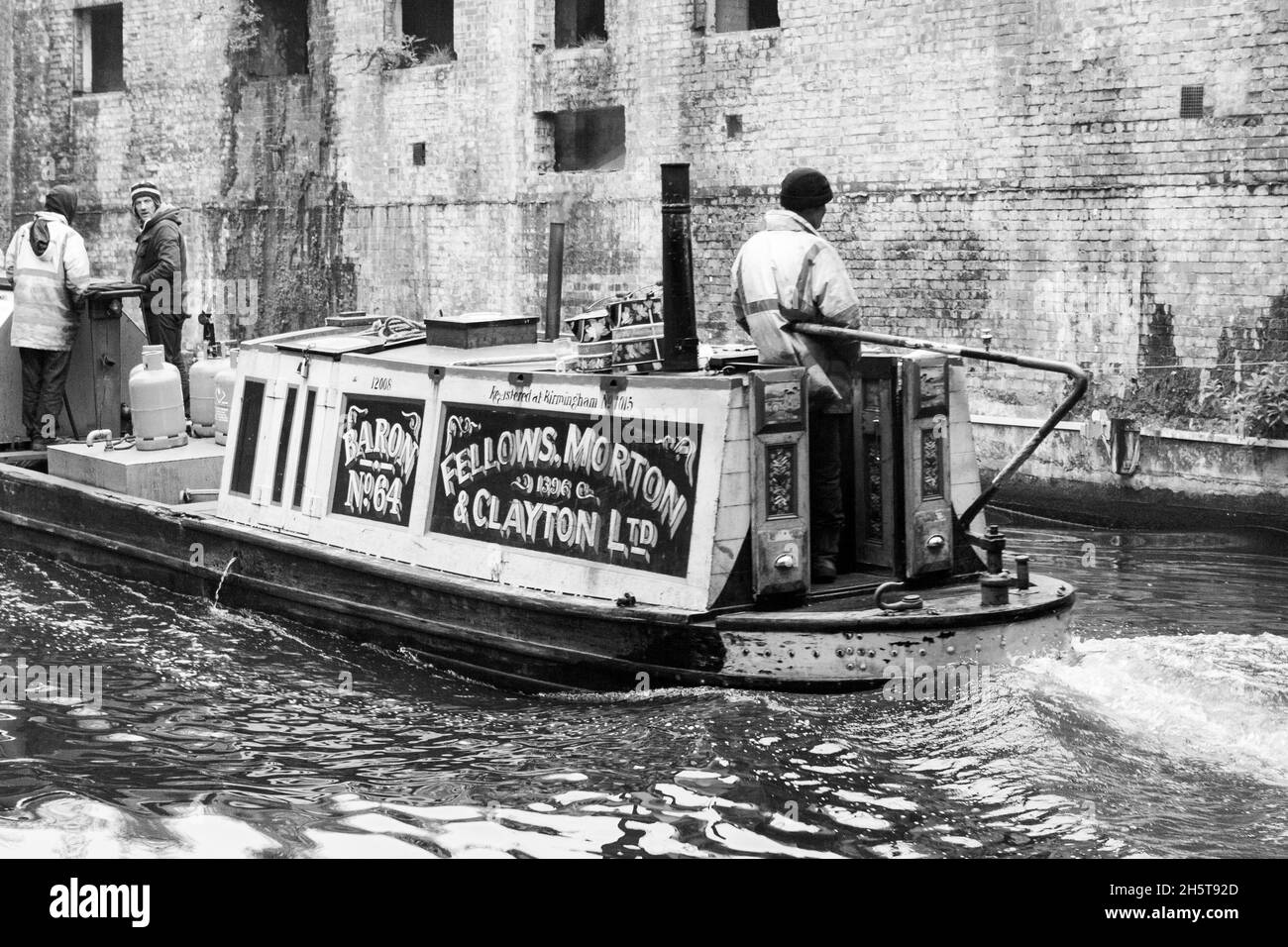 London, United Kingdom; March 16th 2011: Old barge navigating the Regent's Canal. Stock Photo