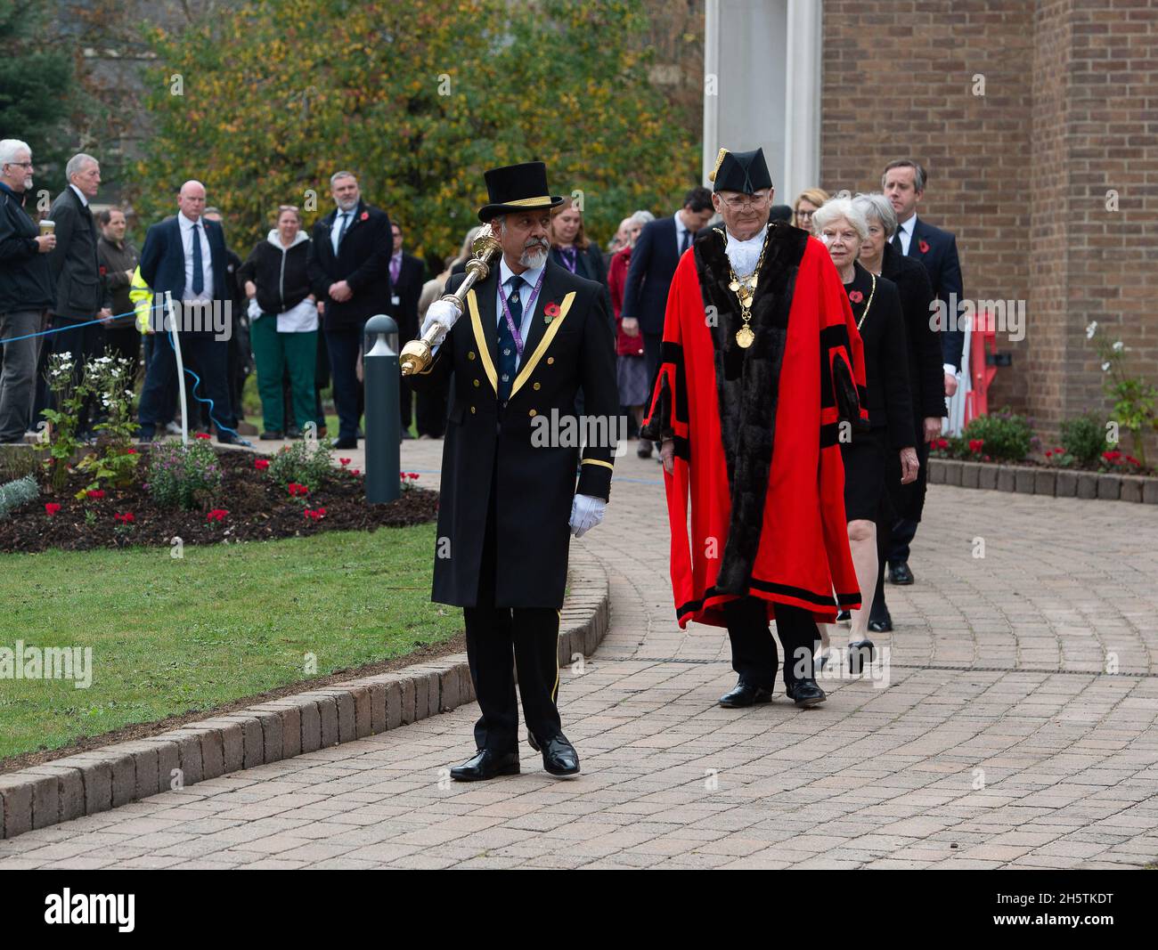 Maidenhead, Berkshire, UK. 11th November, 2021. Councillors from the Royal Borough of Maidenhead and Windsor and local residents attended a service to mark two minutes silence on Remembrance Day this morning at 11.00am. The memorial event was held outside Maidenhead Town Hall at the War Memorial. Councillor John Story, Mayor of the Royal Borough of Maidenhead and Windsor, led tributes to our war dead and serving military personnel. Credit: Maureen McLean/Alamy Live News Stock Photo