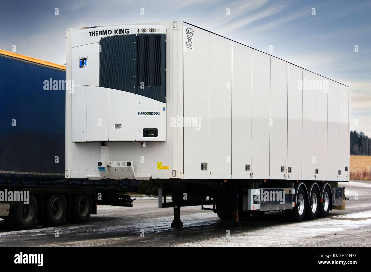 Detached refrigerated semi trailer manufactured by Ekeri Oy with Thermo King SLXE 400 refrigeration unit at truck stop. Salo, Finland. Feb 11, 2017. Stock Photo